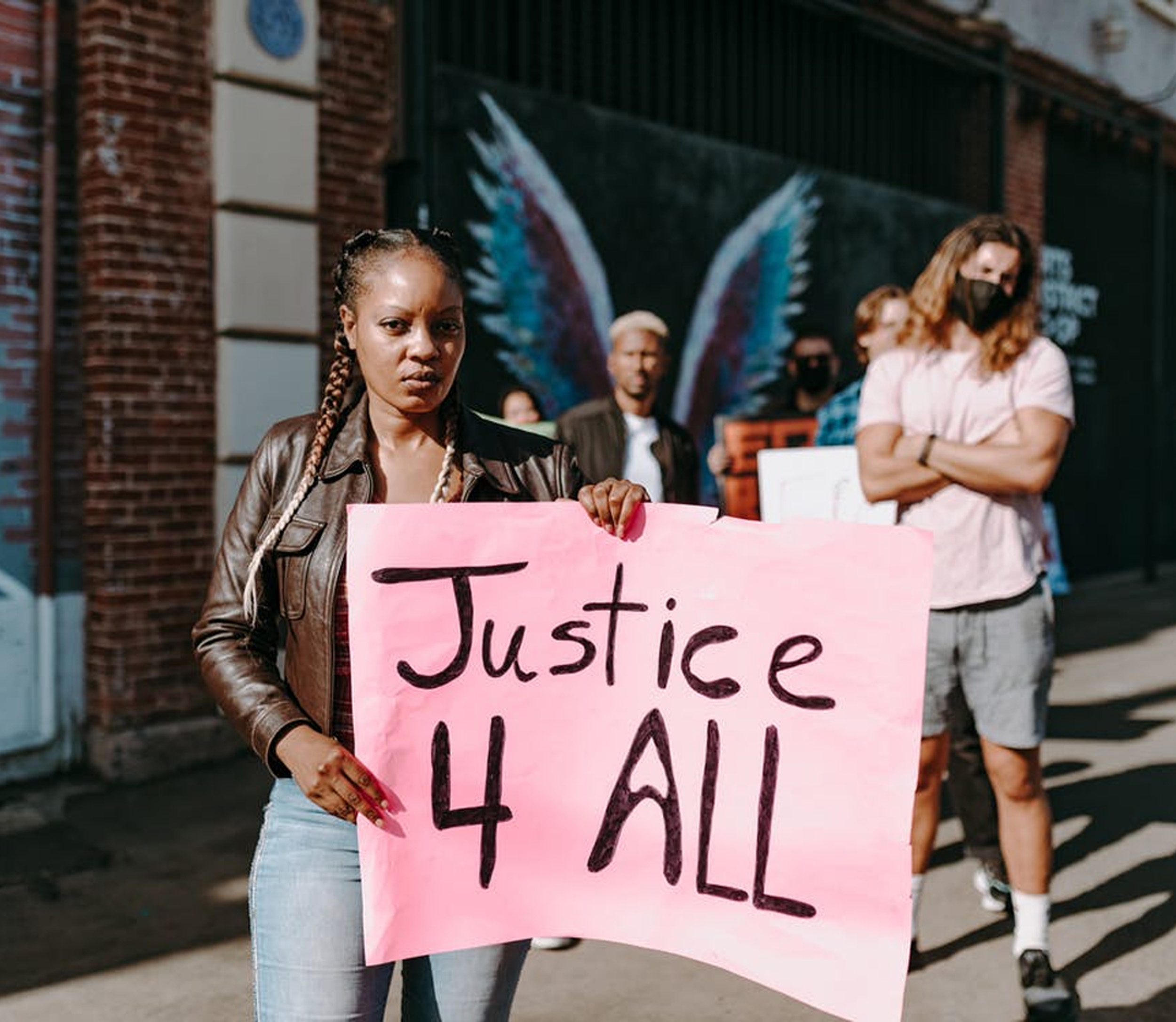 Woman Holding Justice Sign